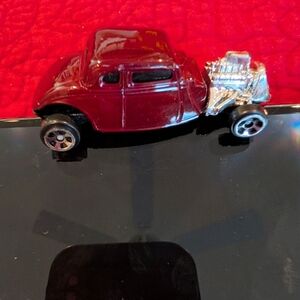 Classic Red Toy Car with Engine Detail